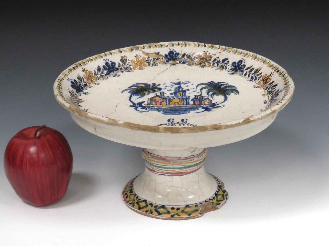 DUTCH FAIENCE DECORATED TAZZA, 17/18TH CENTURY. HEIGHT: DUTCH FAIENCE DECORATED TAZZA, 17/18TH CENTURY. HEIGHT 5 1/2"; DIAMETER 10 1/4" (IMPERFECTIONS/DAMAGES)