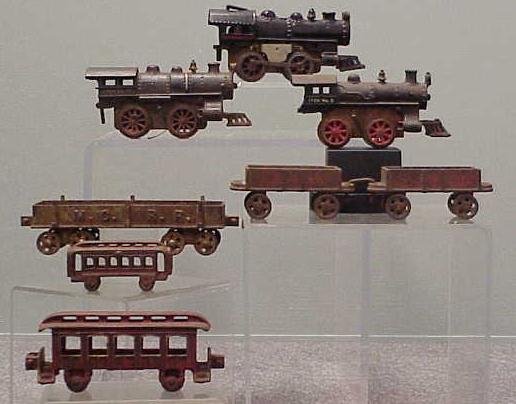 LOT (8) ASSORTED CAST IRON TRAINS: LOT (8) ASSORTED CAST IRON TRAINS INCLUDING (2) IVES ENGINES #5, #17 AND ANOTHER; (5) ASSORTED CARS. (IMPERFECTIONS)