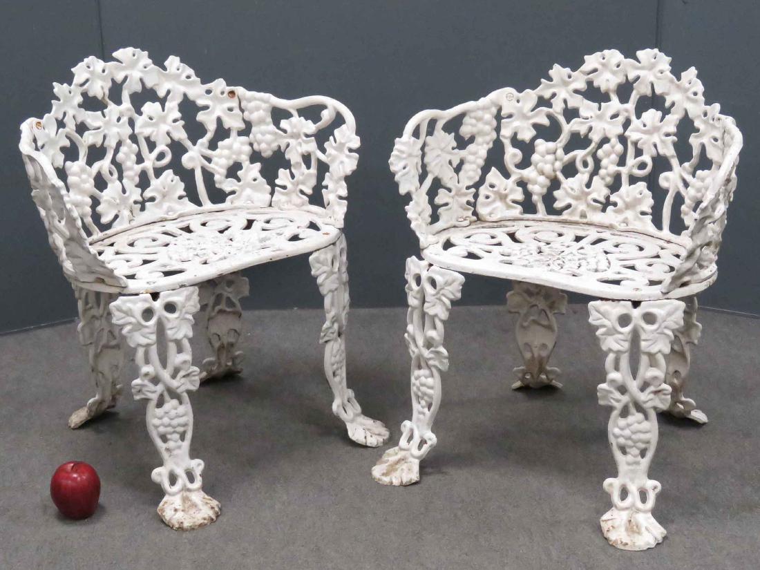PAIR CAST IRON PAINTED GRAPE VINE PATTERN GARDEN SEATS. (1 of 3)