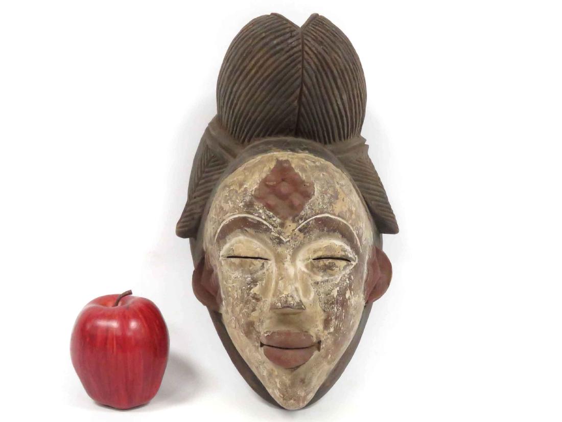PUNU, GABON, CARVED AND PAINTED FEMALE MASK. HEIGHT 12" (1 of 3)