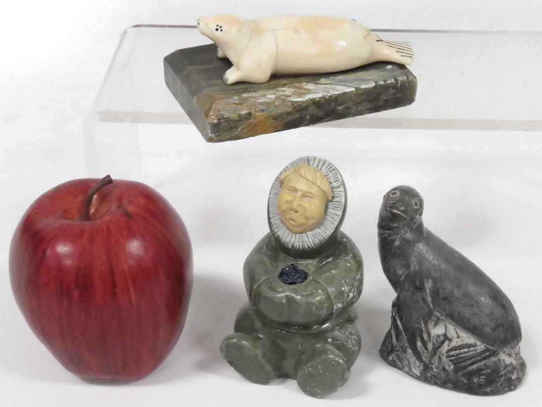 LOT (3) NORTHWEST COAST/ESKIMO INCLUDING CARVED: LOT (3) NORTHWEST COAST/ESKIMO INCLUDING CARVED STEALITE SEATED FIGURE, HEIGHT 4 1/4"; CARVED WALRUS TUSK SEAL, LENGTH 4 1/4"; FAUX STONE SEAL, HEIGHT 3 1/2"