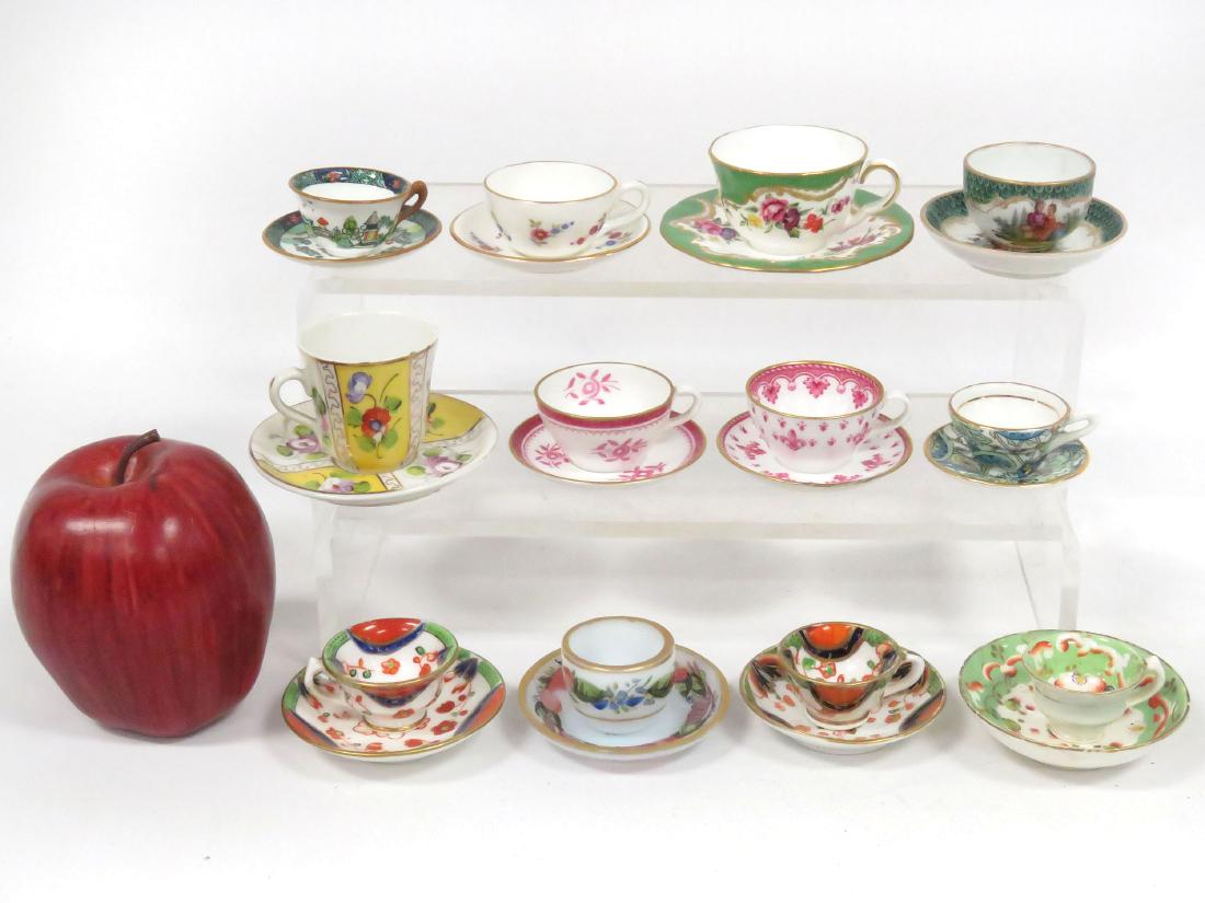 LOT (12) MINIATURE/DEMITASSE PORCELAIN DECORATED CUPS: LOT (12) MINIATURE/DEMITASSE PORCELAIN DECORATED CUPS AND SAUCERS INCLUDING SPODE, ROYAL WORCESTER, CROWN STAFFORDSHIRE (IMPERFECTIONS/HAIRLINES)