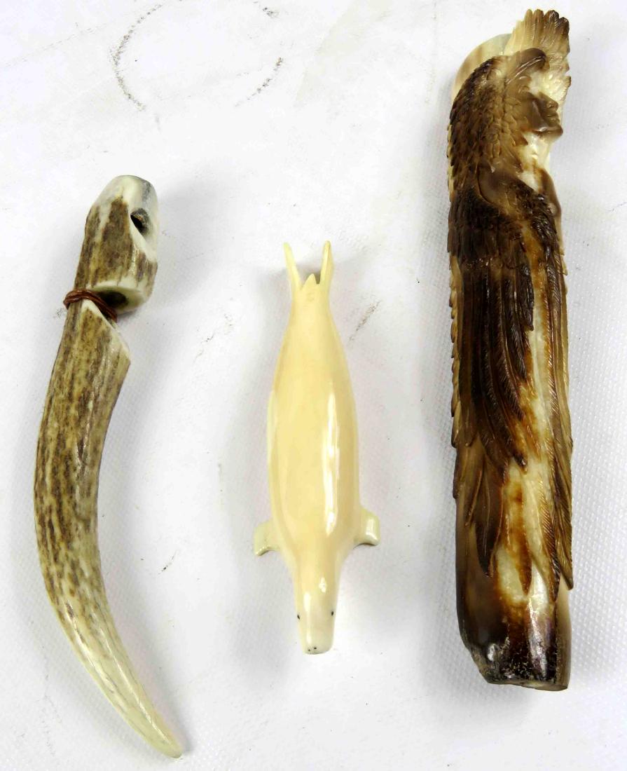 LOT (3) INCLUDING NW COAST CARVED WALRUS TUSK SEAL,: LOT (3) INCLUDING NW COAST CARVED WALRUS TUSK SEAL, LENGTH 4 1/4"; SCRIMSHAW DECORATED ANTLER WHISTLE, LENGTH 6"; NATIVE AMERICAN CARVED ANTLER, LENGTH 7 1/4"