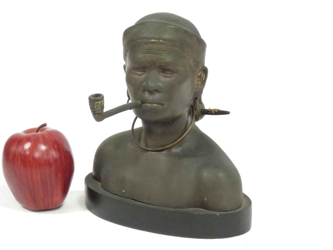 CAMBODIAN BRONZE BUST OF AN ELDER SMOKING A PIPE. (1 of 3)