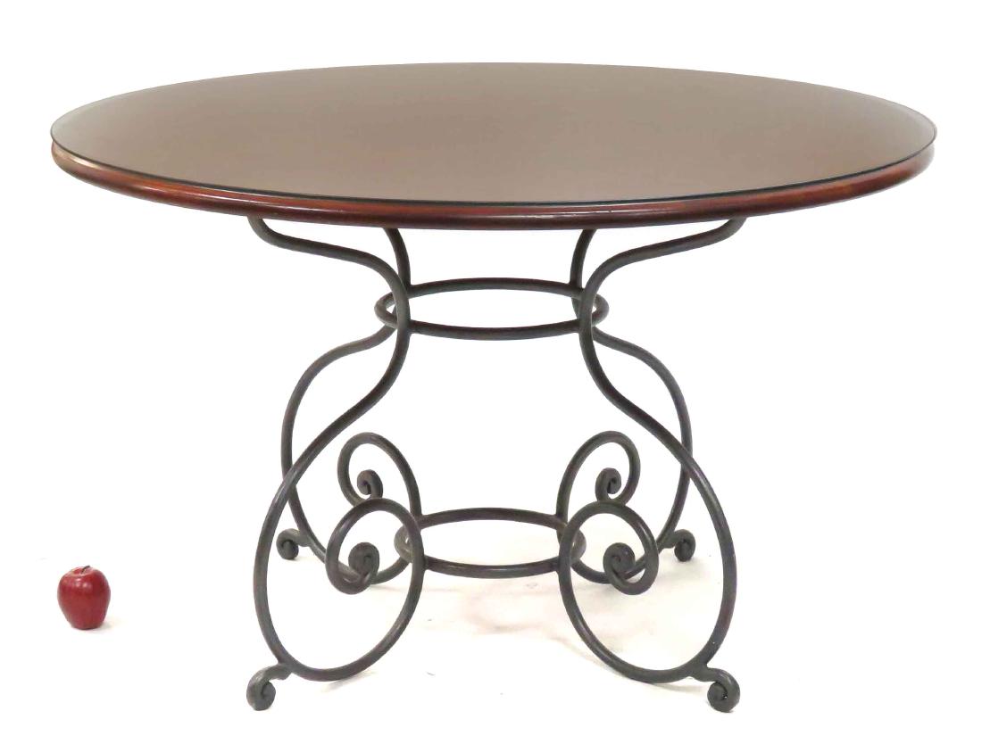 WROUGHT IRON/MAHOGANY ROUND TABLE WITH PLATE GLASS TOP. (1 of 2)