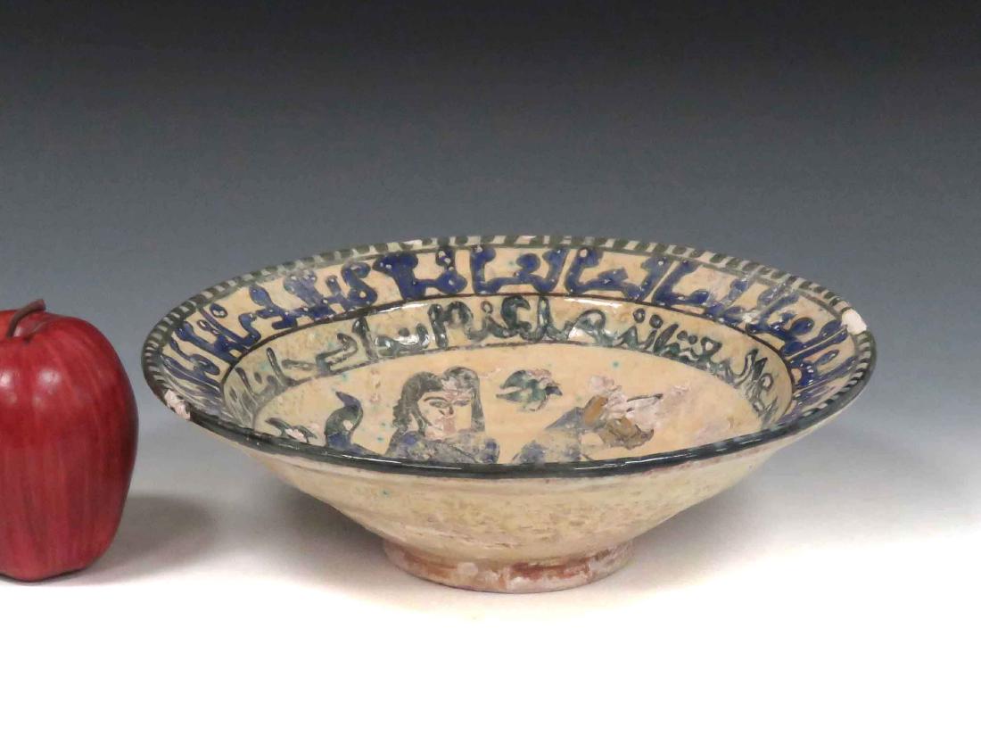 ISLAMIC DECORATED POTTERY BOWL WITH KUFIC SCRIPT.: ISLAMIC DECORATED POTTERY BOWL WITH KUFIC SCRIPT. HEIGHT 3"; DIAMETER 9 3/4"