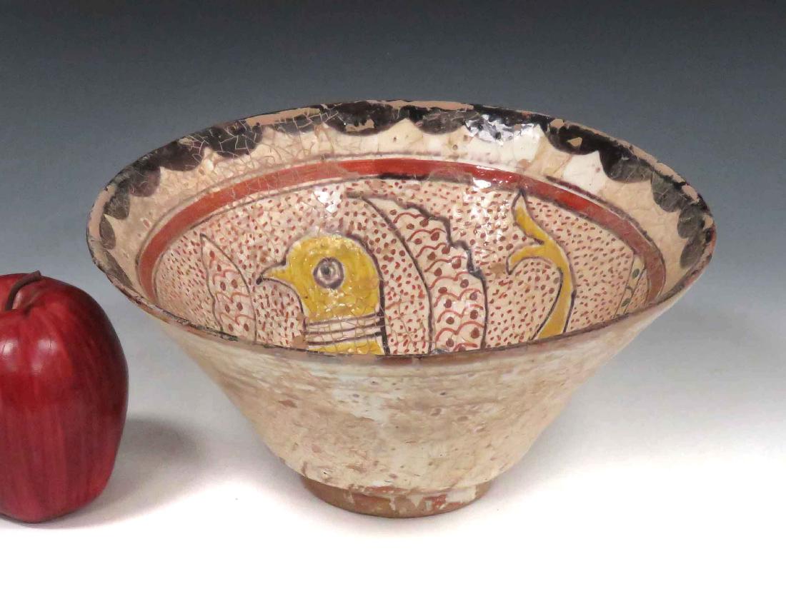 ISLAMIC DECORATED POTTERY BOWL WITH BIRD & FISH. HEIGHT: ISLAMIC DECORATED POTTERY BOWL WITH BIRD & FISH. HEIGHT 4"; DIAMETER 9"