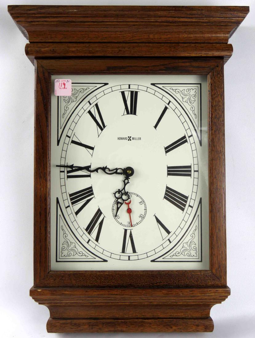 HOWARD MILLER OAK CASED WALL REGULATOR QUARTZ CLOCK.