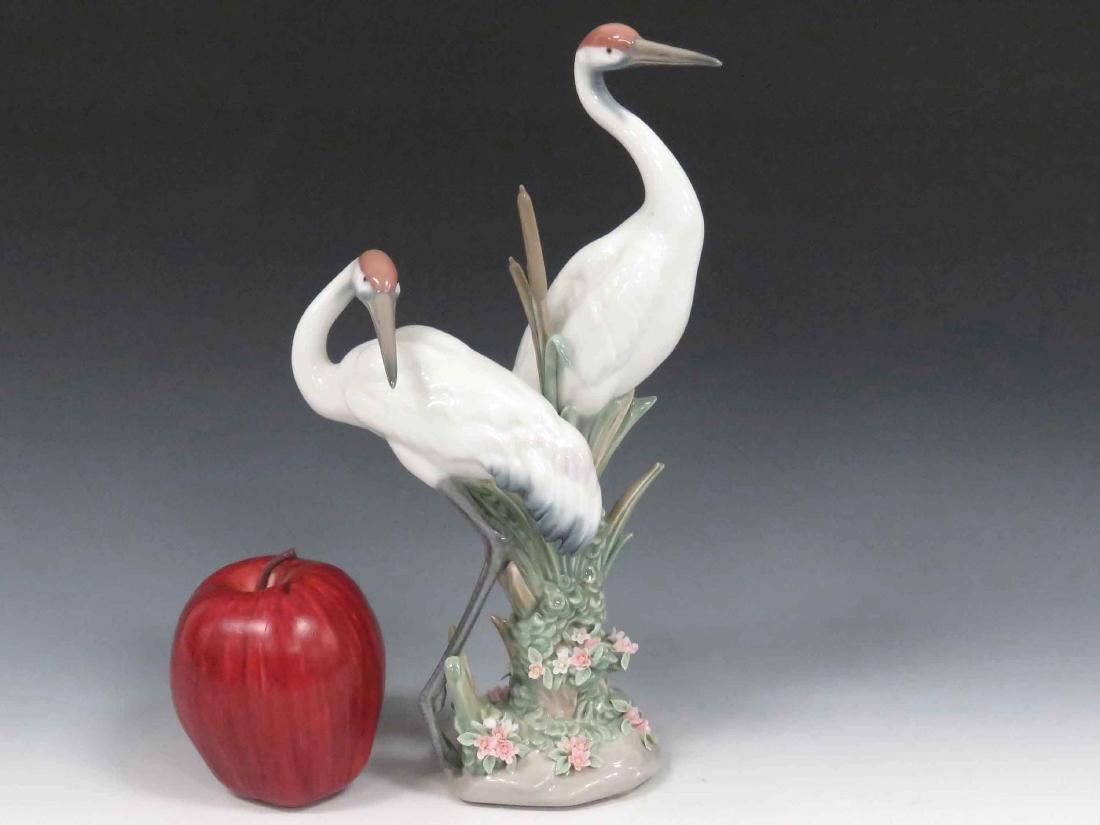 LLADRO PORCELAIN FIGURINE, #1611 COURTING CRANES.: LLADRO PORCELAIN FIGURINE, #1611 COURTING CRANES. HEIGHT 10" (2/PETAL LOSSES)