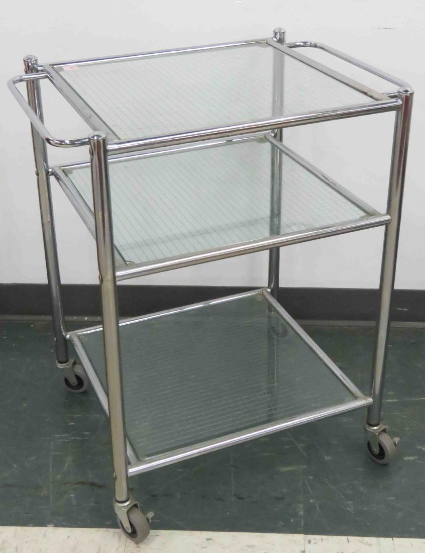 DESIGNER MODERN CHROME STEEL/PLATE GLASS CART. HEIGHT: DESIGNER MODERN CHROME STEEL/PLATE GLASS CART. HEIGHT 29"; LENGTH 24"