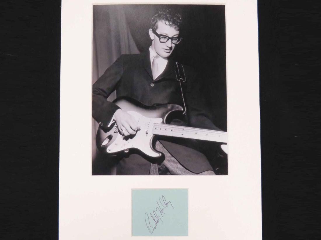 BUDDY HOLLY (AMERICAN 1936-1959, ROCK & ROLL SINGER),: BUDDY HOLLY (AMERICAN 1936-1959, ROCK & ROLL SINGER), INK ON BLUE PAPER, AUTOGRAPH CUT. SIGHT 2 3/8 X 2 3/4"***Please note that none of the signatures have been vetted and carry no COA unless otherwis