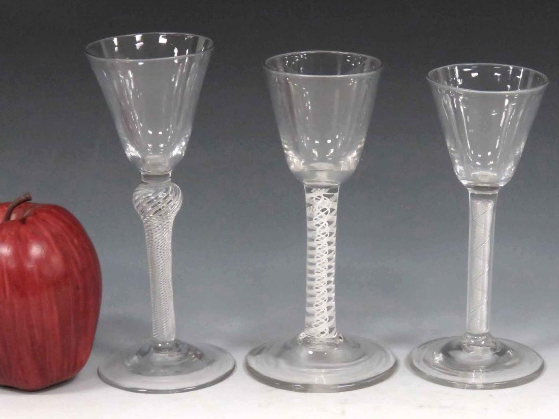 LOT (3) WHITE AIR TWIST WINE GLASSES, PONTIL MARKS,: LOT (3) WHITE AIR TWIST WINE GLASSES, PONTIL MARKS, 18/19TH CENTURY. HEIGHT 5 1/2-6 1/4"