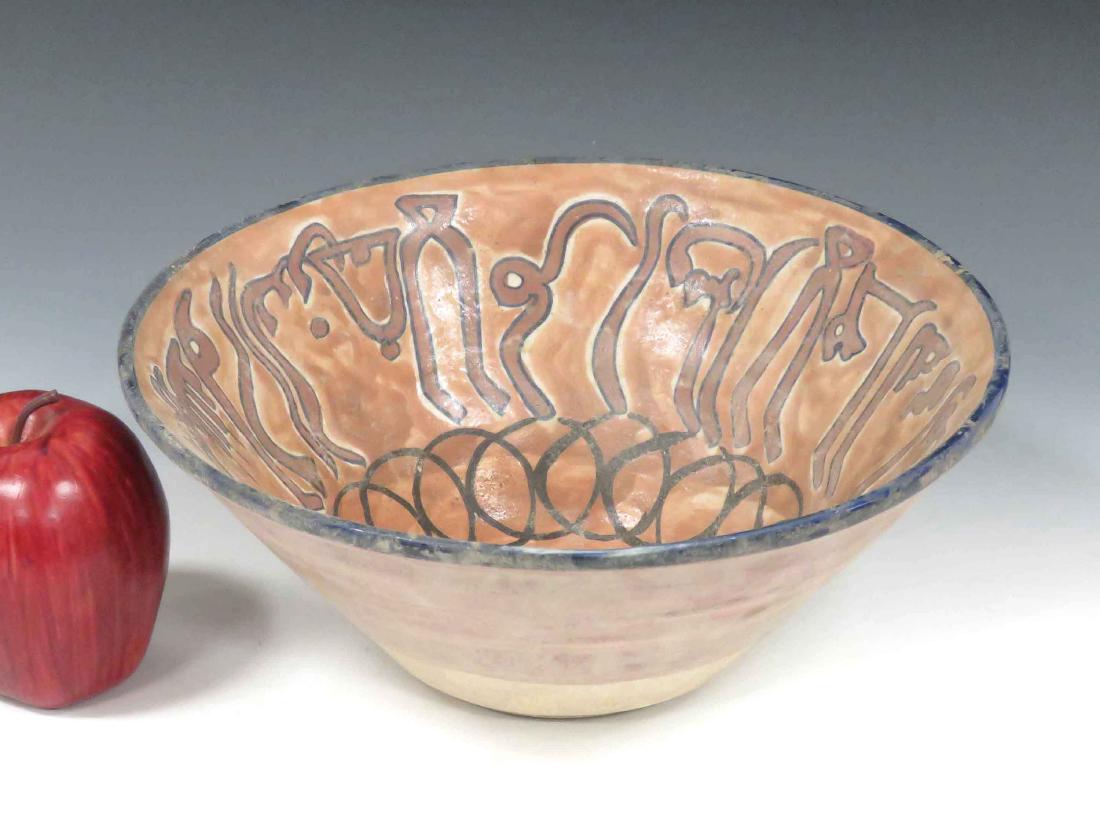 ISLAMIC DECORATED POTTERY BOWL WITH KUFIC SCRIPT.: ISLAMIC DECORATED POTTERY BOWL WITH KUFIC SCRIPT. HEIGHT 4"; DIAMETER 10"