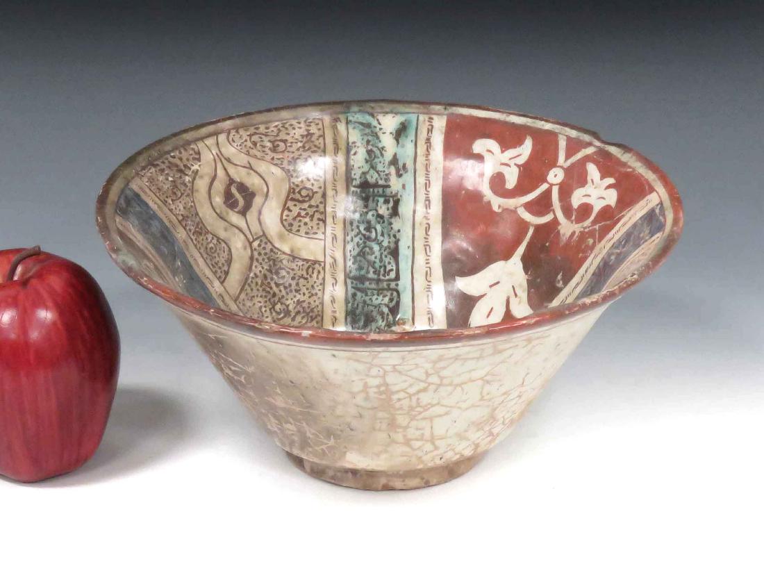 ISLAMIC DECORATED POTTERY BOWL WITH SCRIPT. HEIGHT 4";: ISLAMIC DECORATED POTTERY BOWL WITH SCRIPT. HEIGHT 4"; DIAMETER 9 1/4"