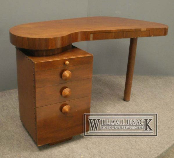 GILBERT RHODE DESIGN DESK: GILBERT RHODE DESIGN FOR HERMAN MILLER MAHOGANY/UPHOLSTERED FREE-FORM DESK. HEIGHT 29"; WIDTH 51" **DUE TO THE SIZE AND/OR FRAGILITY OF THIS LOT IN-HOUSE SHIPPING IS NOT AVAILABLE. PLEASE NOTE A LIST