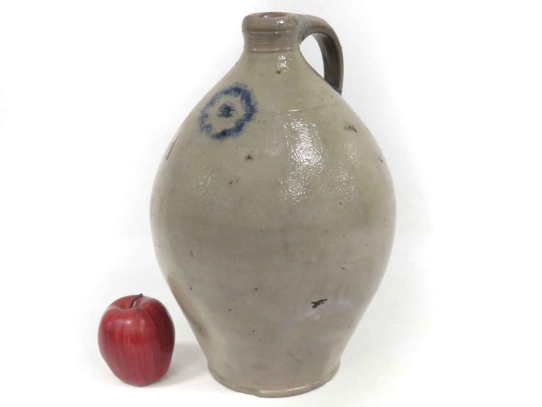 ATTRIBUTED TO CAPTAIN JAMES MORGAN, CHEESEQUAKE, NJ,: ATTRIBUTED TO CAPTAIN JAMES MORGAN, CHEESEQUAKE, NJ, OVOID STONEWARE JUG, 19TH CENTURY. HEIGHT 15" (SURFACE POCKS, BASE CHIP)