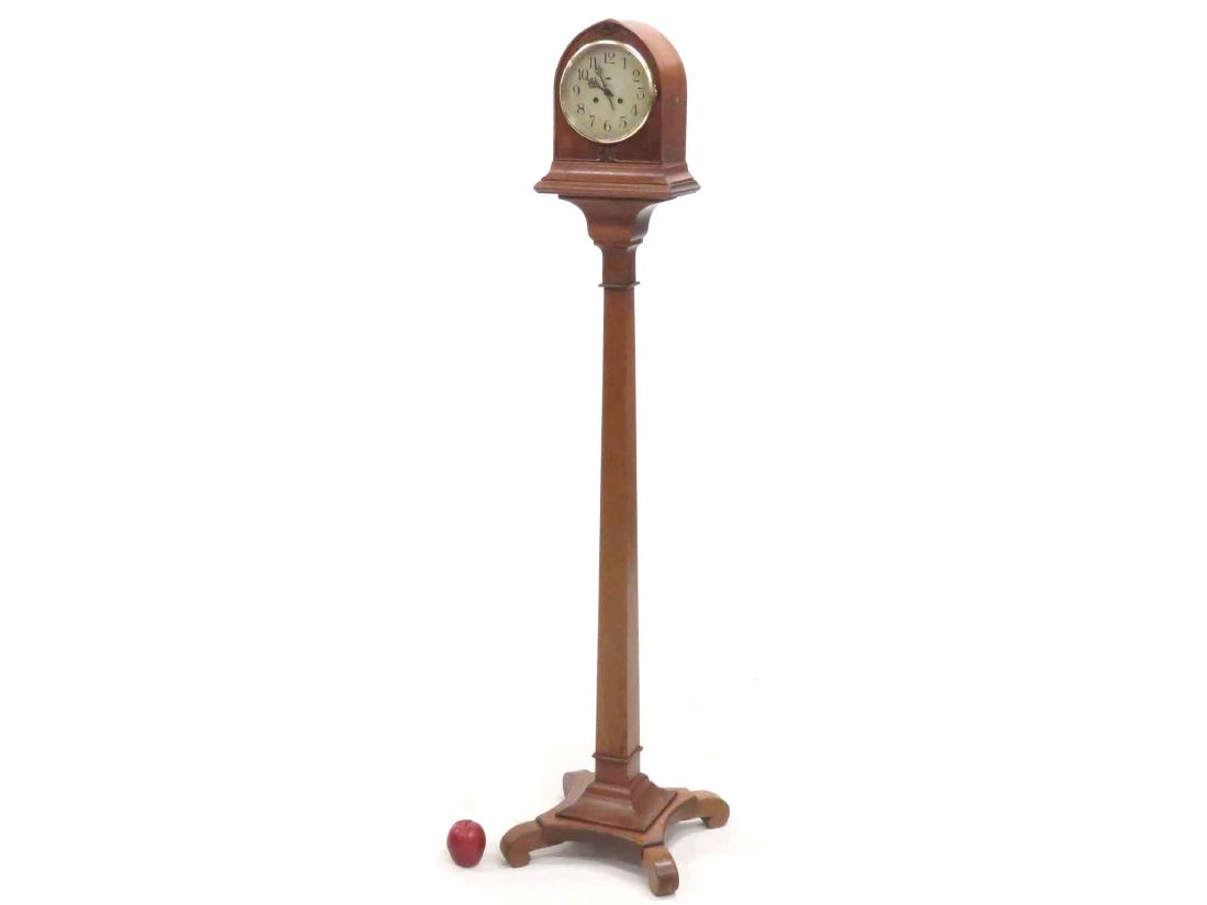 VINTAGE NEW HAVEN CARVED MAHOGANY GOTHIC CLOCK ON: VINTAGE NEW HAVEN CARVED MAHOGANY GOTHIC CLOCK ON PEDESTAL BASE. HEIGHT 65"