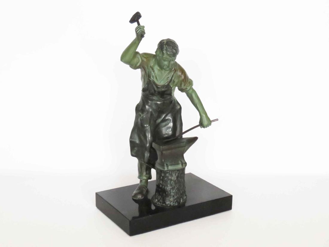 PATINATED CAST METAL FIGURE OF A BLACKSMITH. HEIGHT 12" (1 of 3)