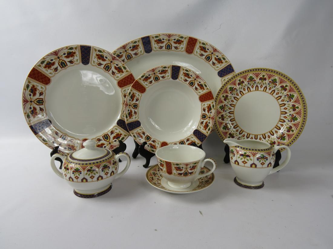 QUEEN'S "IMARI" PORCELAIN PARTIAL DINNER SERVICER,: QUEEN'S "IMARI" PORCELAIN PARTIAL DINNER SERVICER, INDIA.((8) each dinner plate, salad/luncheon, bowls, cups and saucers, (1) oval platter and creamer/sugar. Medium to heavy utensil wear to dinner pla