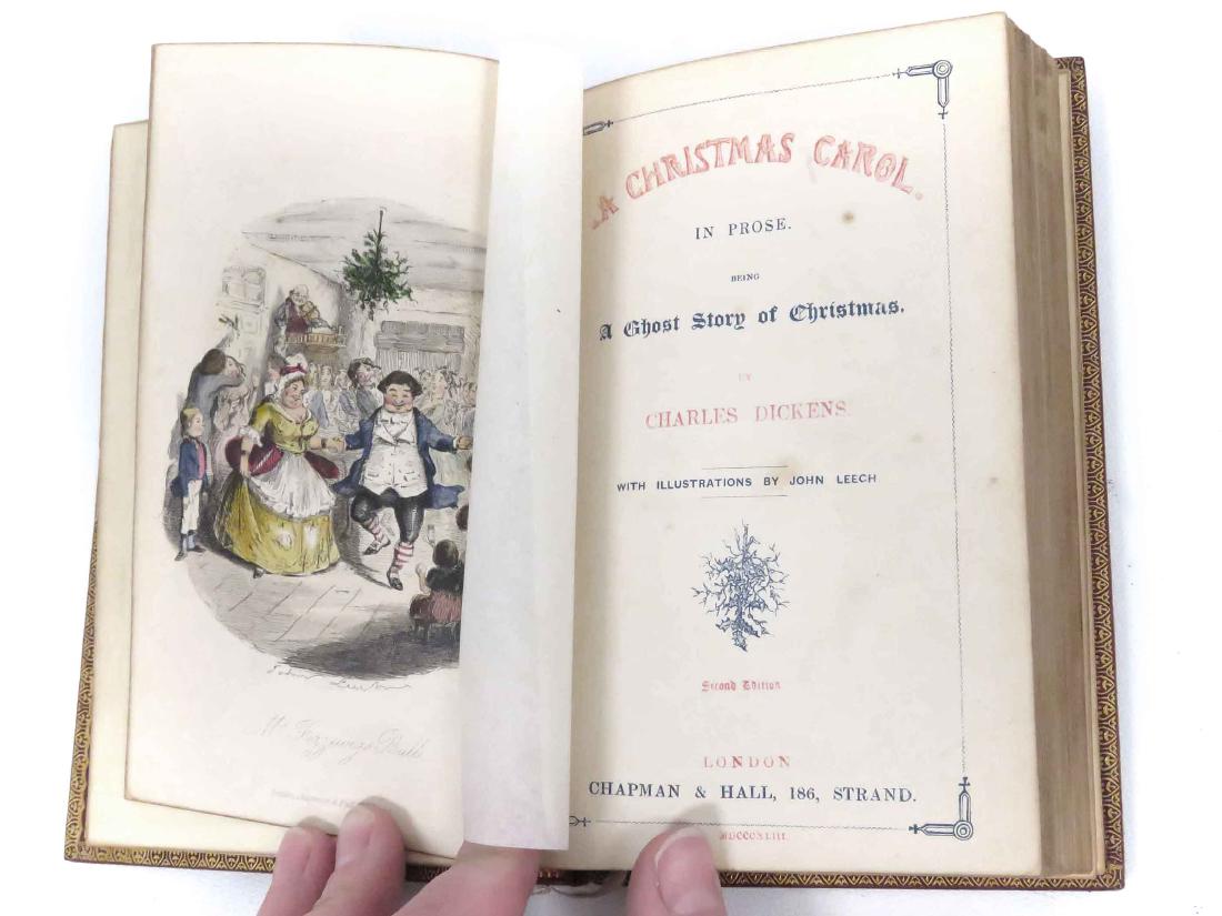 VOL-A CHRISTMAS CAROL, DICKENS 1ST ED SECOND STATE 1843: VOLUME - A CHRISTMAS CAROL, DICKENS, 1ST ED., SECOND DATE, 1843, CHAPMAN & HALL, GILT LEATHER BINDING, 8vo ("SLAVE ONE", TITLE PAGE PRINTED IN RED & BLUE, GREEN END PAPERS, (4) HAND COLORED PLATED BY