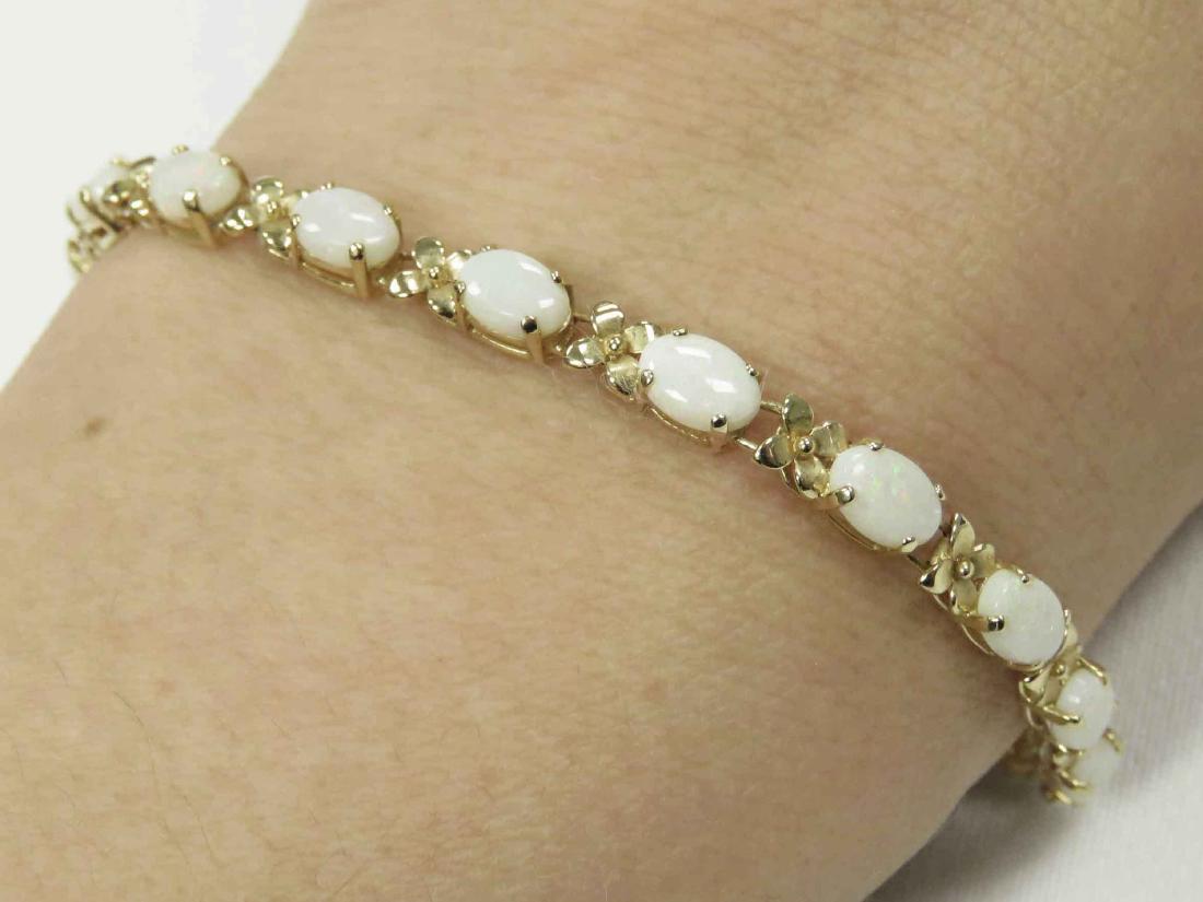 14K YELLOW GOLD AND OPAL LINE BRACELET, MEXICO. LENGTH: 14K YELLOW GOLD AND OPAL LINE BRACELET, MEXICO. LENGTH 7 3/8"; GROSS WEIGHT 5.98 GRAMS