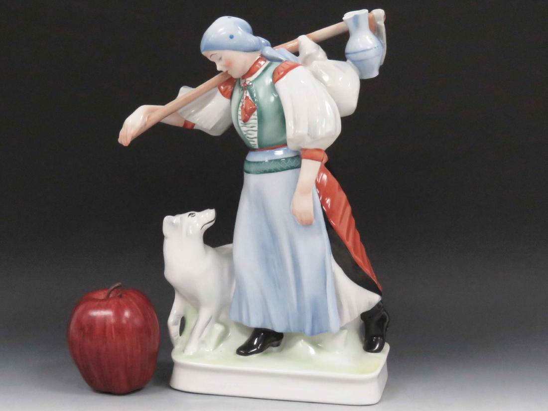 ZSOLNAY PORCELAIN DECORATED FIGURE, PEASANT WOMAN WITH: ZSOLNAY PORCELAIN DECORATED FIGURE, PEASANT WOMAN WITH DOG. HEIGHT 12 1/2"