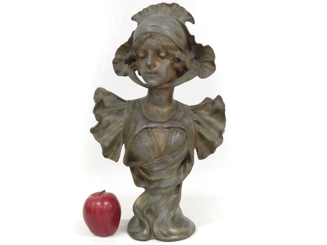 ART NOUVEAU PATINATED SPELTER BUST OF A YOUNG WOMAN,: ART NOUVEAU PATINATED SPELTER BUST OF A YOUNG WOMAN, SIGNED "H. JACOBS, COPYRIGHT 1904 BY NAPOLEON ALLIOT". HEIGHT 18 1/4"