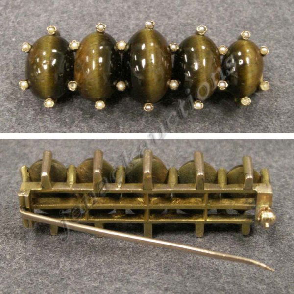 VINTAGE YELLOW GOLD (TESTS 14K) BROOCH: VINTAGE YELLOW GOLD (TESTS 14K) BROOCH WITH (5) TIGER EYE QUARTZ CABOCHONS. LENGTH 1 3/4"; 10.95 GR GROSS