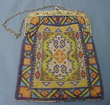 VINTAGE GLASS BEADED HAND BAG: VINTAGE GLASS BEADED HAND BAG WITH GILT RETICULATED & JEWELED FRAME WITH KID LINING & CHAIN HANDLE. 9 X 7"