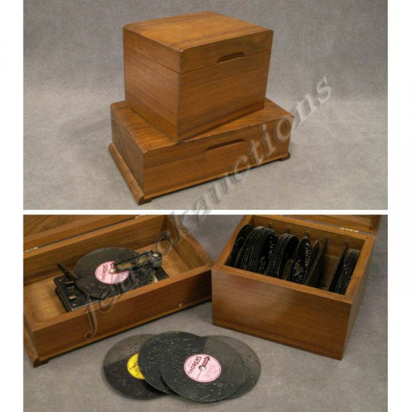 LOT (2) SWISS PORTABLE MUSIC BOX RECORD PLAYER: LOT (2) SWISS PORTABLE MUSIC BOX RECORD PLAYER WITH (30) THORENS 4-INCH RECORDS CASED IN MAHOGANY BOXES. HEIGHT 3 3/4" & 5 1/2"; LENGTH 11 1/2" & 7 1/2" (SPRING IS SPRUNG)