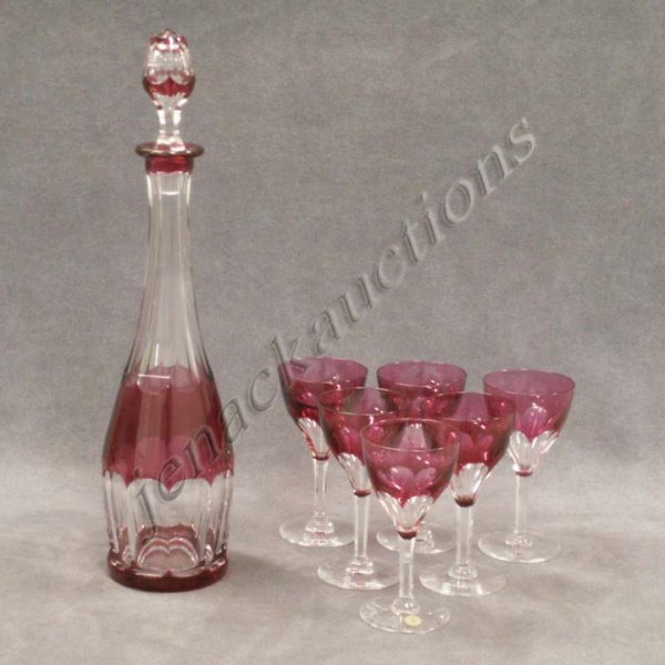 VAL ST. LAMBERT CRANBERRY CUT TO CLEAR DECANTER: VAL ST. LAMBERT CRANBERRY CUT TO CLEAR GLASS DECANTER AND (6) WINES. HEIGHT DECANTER 16" ; 1/WITH ORIGINAL LABEL