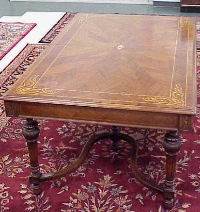 FRENCH STYLE DINING TABLE: FRENCH STYLE CARVED/INLAID WALNUT DINING TABLE, SIGNED/METAL TAG "CUSTOM MADE FURNITURE THE LEONARD CO. NEW YORK MANUFACTURES". HEIGHT 30"; TOP 44 X 72" **DUE TO THE SIZE AND OR WEIGHT OF THIS ITEM, S