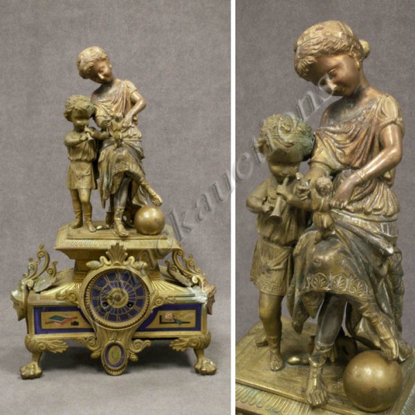 FRENCH GILT/POLYCHROMED BRONZE FIGURAL SHELF CLOCK: FRENCH GILT/POLYCHROMED BRONZE FIGURAL SHELF CLOCK, 19TH CENTURY. HEIGHT 18"; WIDTH 12" (TARNISH/CRACK TO RIGHT SIDE OF CASE; NO KEY OR PENDULUM)