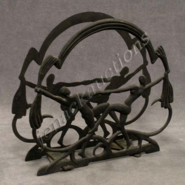 ART DECO CAST IRON MAGAZINE RACK, SIGNED: ART DECO CAST IRON MAGAZINE RACK, SIGNED SEVILLE ART METAL, COPYRIGHT 1923. HEIGHT 12 3/4"
