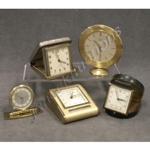 LOT (5) TRAVEL/DESK CLOCKS: LOT (5) TRAVEL/DESK CLOCKS INCLUDING (3) RENSIE 7-JEWEL WITH ORIGINAL BOXES, LE COULTRE & SEMCA. HEIGHT 2 5/8 - 4 5/8" (GILT WEAR)