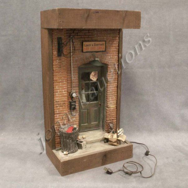 MICHAEL GARMAN (AMERICAN 20TH CENTURY), COMPOSITION: MICHAEL GARMAN (AMERICAN 20TH CENTURY), LIGHTED WOOD/COMPOSITION DIORAMA/SCULPTURE, "LEROY & BERTHA'S BAR AND GRILL". HEIGHT 25 3/4"; WIDTH 15"