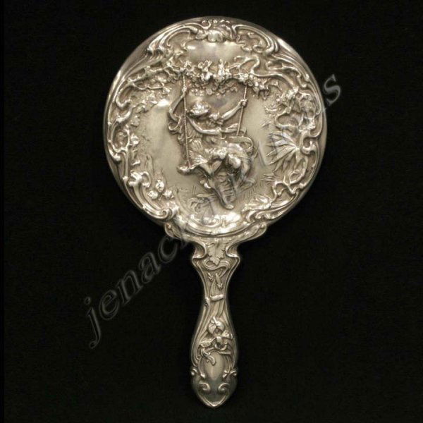 THEODORE W. FOSTER & BRO STERLING HAND MIRROR: THEODORE W. FOSTER & BRO STERLING ART NOUVEAU HAND MIRROR. LENGTH 9 1/4"
