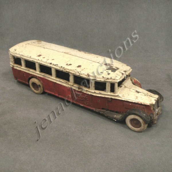 VINTAGE ARCADE CAST IRON "MACK 6" BUS WITH DRIVER: VINTAGE ARCADE CAST IRON "MACK 6" BUS WITH DRIVER, SIGNED. LENGTH 13" (NO BUMPER, PAINT CHIPPING, RUSTING)
