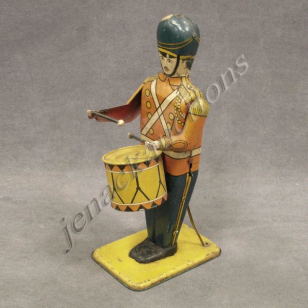 VINTAGE WOLVERINE #27 TIN WIND-UP DRUM MAJOR: VINTAGE WOLVERINE #27 TIN WIND-UP DRUM MAJOR, SIGNED. HEIGHT 13 1/2" (HESITANT)