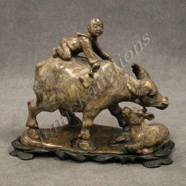 CHINESE CARVED SOAPSTONE WATER BUFFALO GROUP: CHINESE CARVED SOAPSTONE WATER BUFFALO GROUP, SIGNED WITH STAND. HEIGHT 5 3/4"; LENGTH 6 1/2"