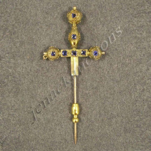 YELLOW GOLD ETRUSCAN STYLE CROSS STICK PIN: YELLOW GOLD (TESTS 14K) ETRUSCAN STYLE CROSS STICK PIN WITH BLUE PASTE FACETED STONES. LENGTH 3"; GROSS WEIGHT 4.01 GRAMS (MISSING CHAIN)