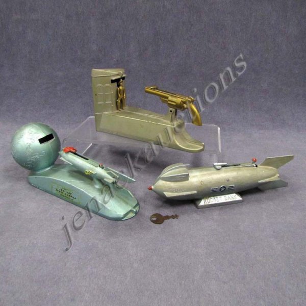 LOT (3) VINTAGE DURO MECHANICAL METAL BANKS: LOT (3) VINTAGE DURO MECHANICAL METAL BANKS INCLUDING WILD WEST BANK, ROCKET BANK, STRATO BANK, C.1950'S. LENGTH 8"