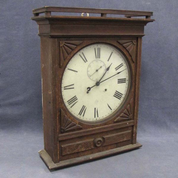 SETH THOMAS CARVED OAK GALLERY CLOCK, 19TH CENTURY: SETH THOMAS CARVED OAK GALLERY CLOCK, 19TH CENTURY. HEIGHT 27"; WIDTH 20"
