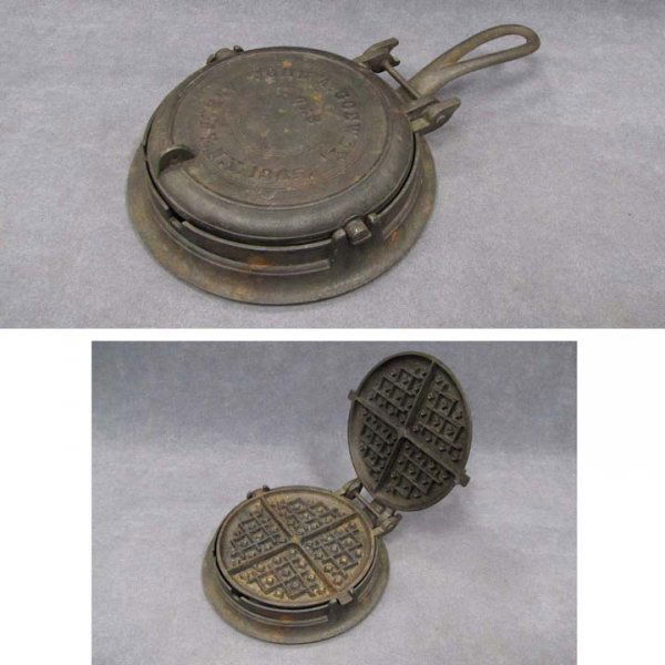 VINTAGE JOHN A GOEY CAST IRON WAFFLE IRON: VINTAGE JOHN A GOEY CAST IRON WAFFLE IRON. LENGTH 14"
