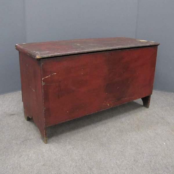 SHAKER PAINTED 6-BOARD BLANKET CHEST: PAINTED PINE 6-BOARD BLANKET BOX WITH OLD RED PAINT, ATTRIBUTED TO SHAKER WORKSHOPS, 19TH CENTURY. HEIGHT 25"; WIDTH 43 1/2"; DEPTH 18 1/2" (SEE CANTERBURY PAGE 246; RIEMAN & BURKS)