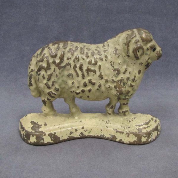 VINTAGE CAST BRASS RAM DOOR STOP, SIGNED N & I: VINTAGE CAST BRASS RAM DOOR STOP, SIGNED N & I. HEIGHT 6 1/2" (PAINT LOSS)