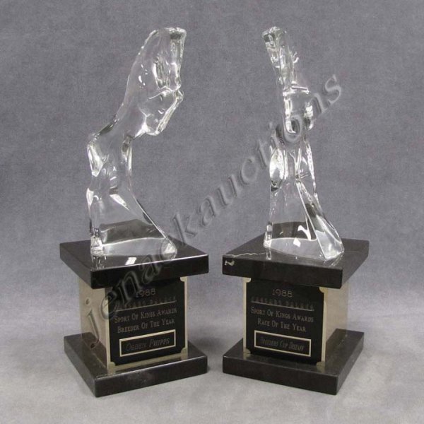 LOT (2) BACCARAT CRYSTAL AND MARBLE BASE: LOT (2) BACCARAT CRYSTAL AND MARBLE BASE "SPORT OF KINGS" TROPHIES - CAESARS PALACE, BREEDER/RACE OF THE YEAR, 1988, SIGNED. HEIGHT 14 1/2"