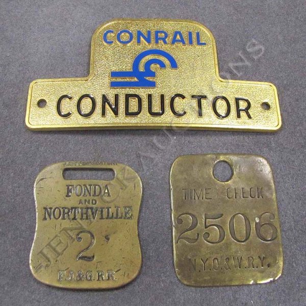 LOT (3) INCLUDING NY O & W RY TOOL CHECK, #2506: LOT (3) INCLUDING NY O & W RY TOOL CHECK, #2506; FJ & G RR (FONDA JOHNSTON AND GLOVERVILLE) BRASS BAGGAGE TAG #2; AND CONRAIL CONDUCTORS HAT BADGE
