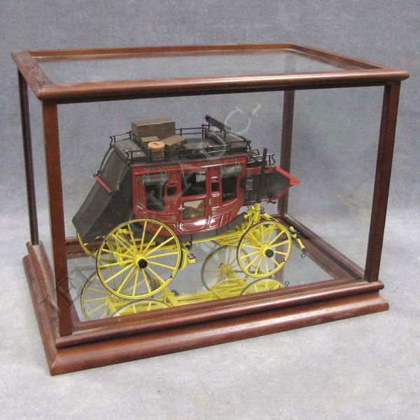 WELLS FARGO & CO. OVERLAND STAGE COACH METAL MODEL: WELLS FARGO & CO. OVERLAND STAGE COACH METAL MODEL, HEIGHT 7"; LENGTH 10 1/2" WITH GLASS CASE, HEIGHT 11"; LENGTH 15"