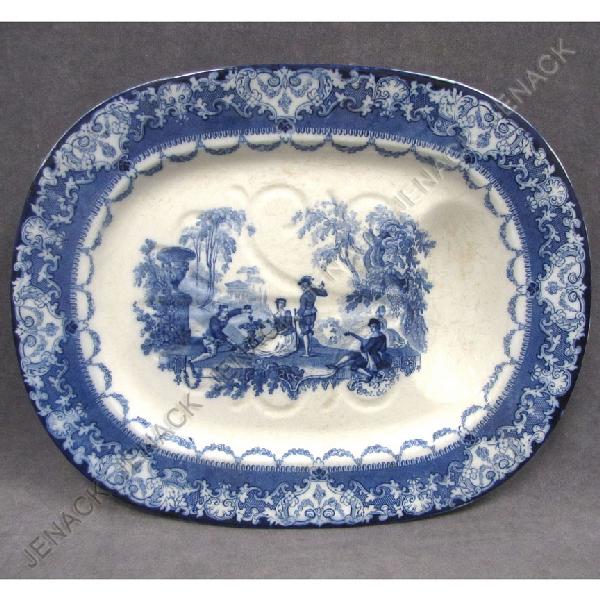 DOULTON "WATTEAU" FLOW BLUE MEAT PLATTER: DOULTON "WATTEAU" FLOW BLUE TRANSFER DECORATED TREE AND WELL MEAT PLATTER. 19 1/4 X 15 1/4" (SOME STAINING AND CRAZING)